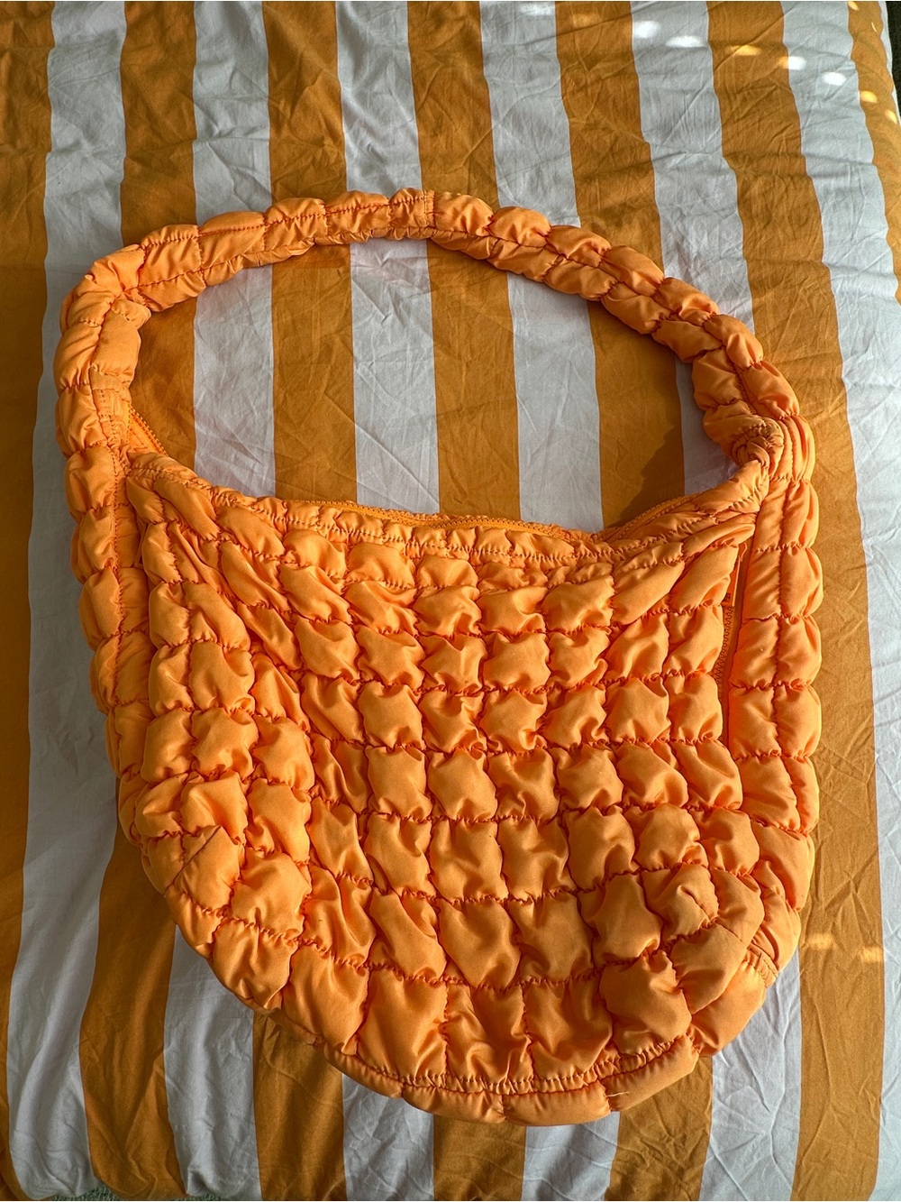 Orange puffy bag